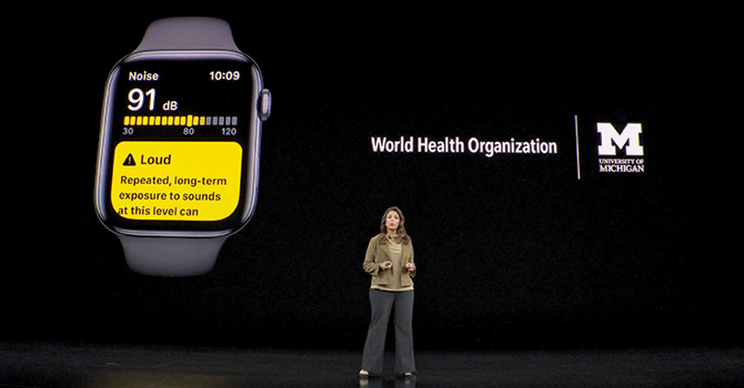 An Apple Watch next to a presenter for the World Health Organization’s “Make Listening Safe” initiative to inform new policies around hearing health around the world.