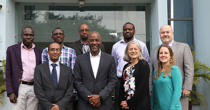 Berhanu Gebremeskal, Amy Sarigiannis, DuBois Bowman, Rivet Amico, and Gary Harper of Michigan Public Health pose with members from the African Population Health Research Center (APHRC).