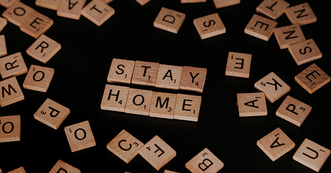 Stay home written in Scrabble letters.