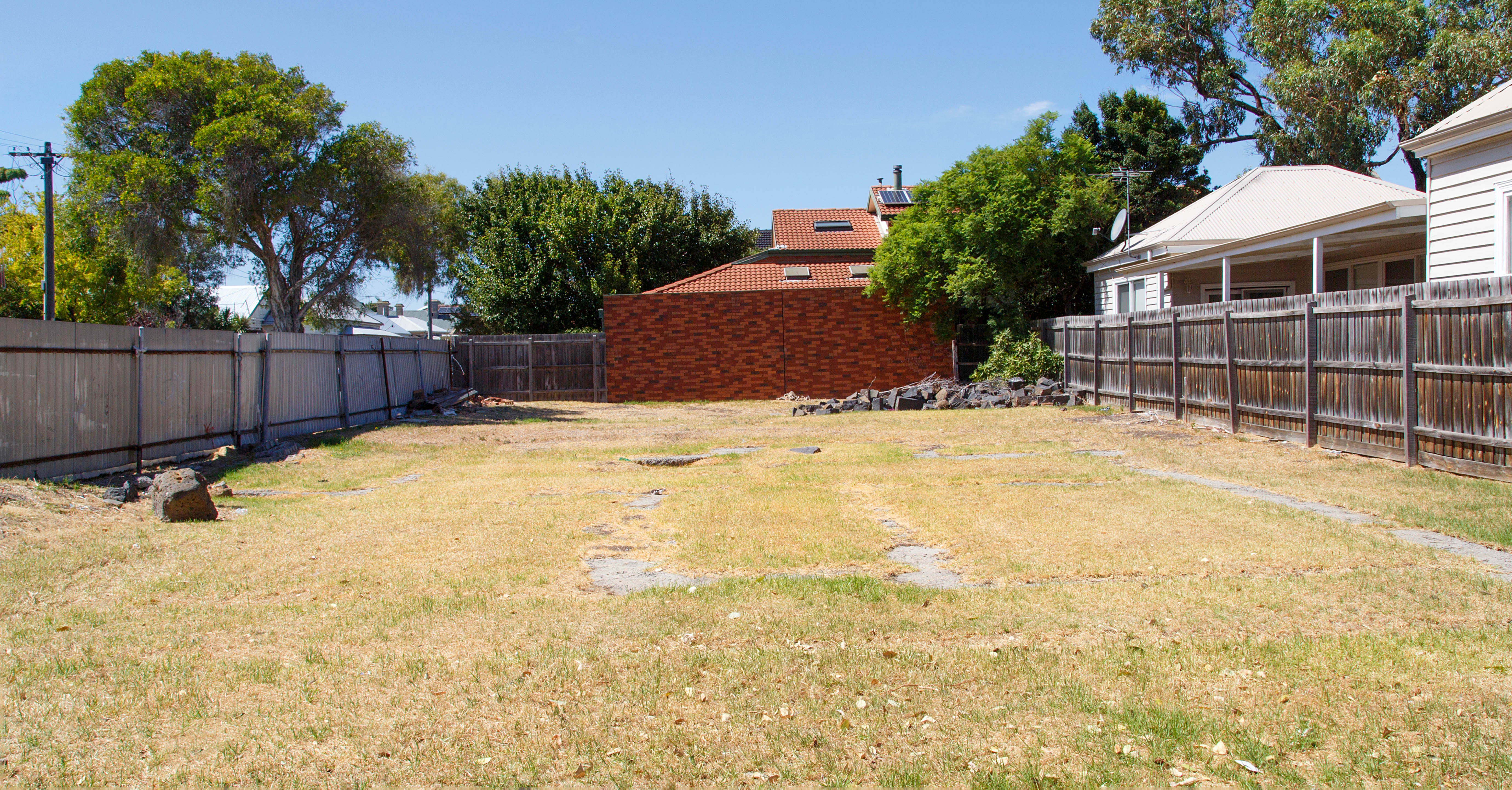 An image of a vacant lot where a house once stood.
