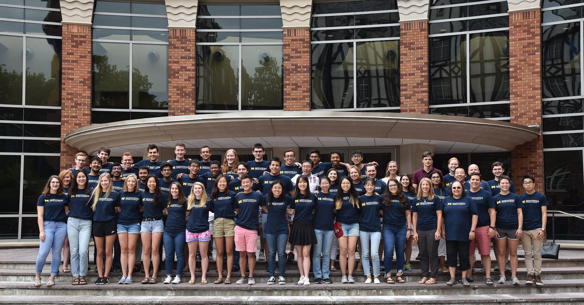 A group of students attending the 2019 Big Data Summer Institute gather in front of the U-M School of Public Health.