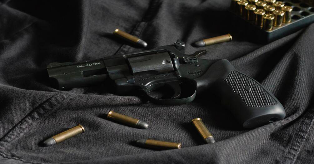 image of gun and bullets
