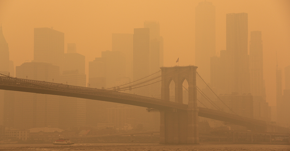 A veil of smog covers a city
