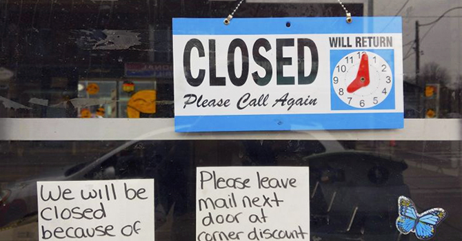 Closed sign on a storefront