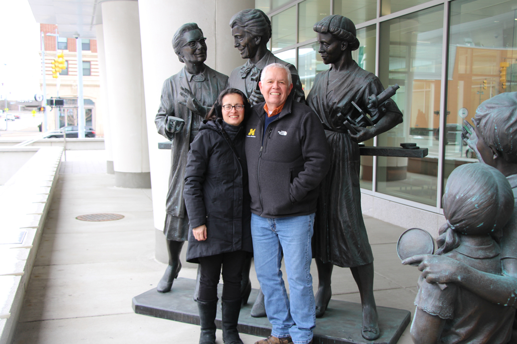 Matt Boulton and his wife, Chitra, with the statue of Kendrick, Eldering, and Gordon unveiled in September 2019 in Grand Rapids.