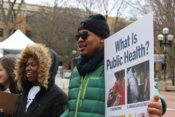 students on campus promoting public health